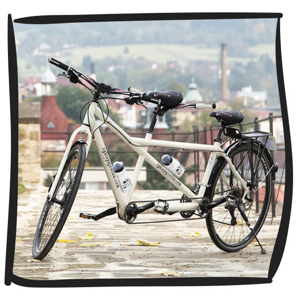 The tandem bicycle can be fitted with bags and a trolley can be attached behind it for truly long routes.